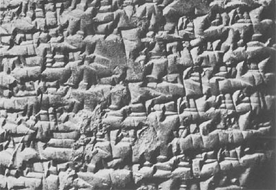 Close up on a section of a cuneiform tablet inscription.