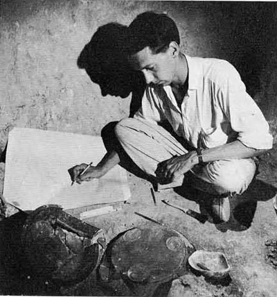 The author recording the position of the large pottery plates just north of the head of the skeleton within the tomb. Tombs of this date, unlike earlier ones, are large enough to allow one to record the many details in reasonable comfort.