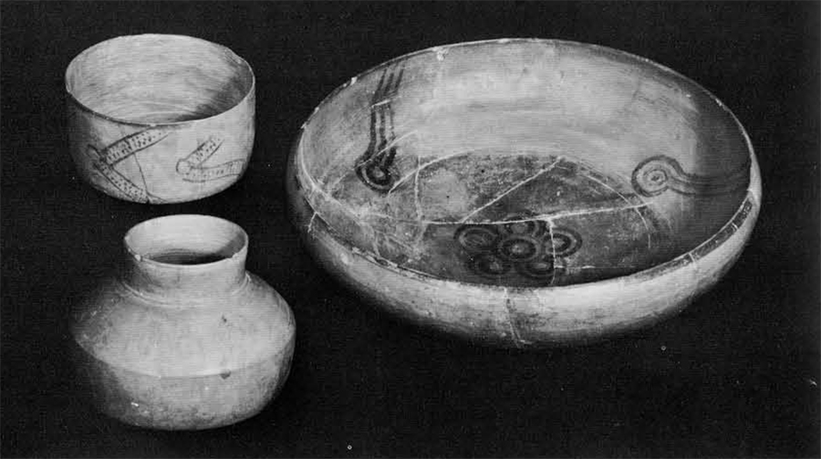 A large greyware bowl and two vessels of the same type.