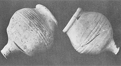 Two round drinking vessels.