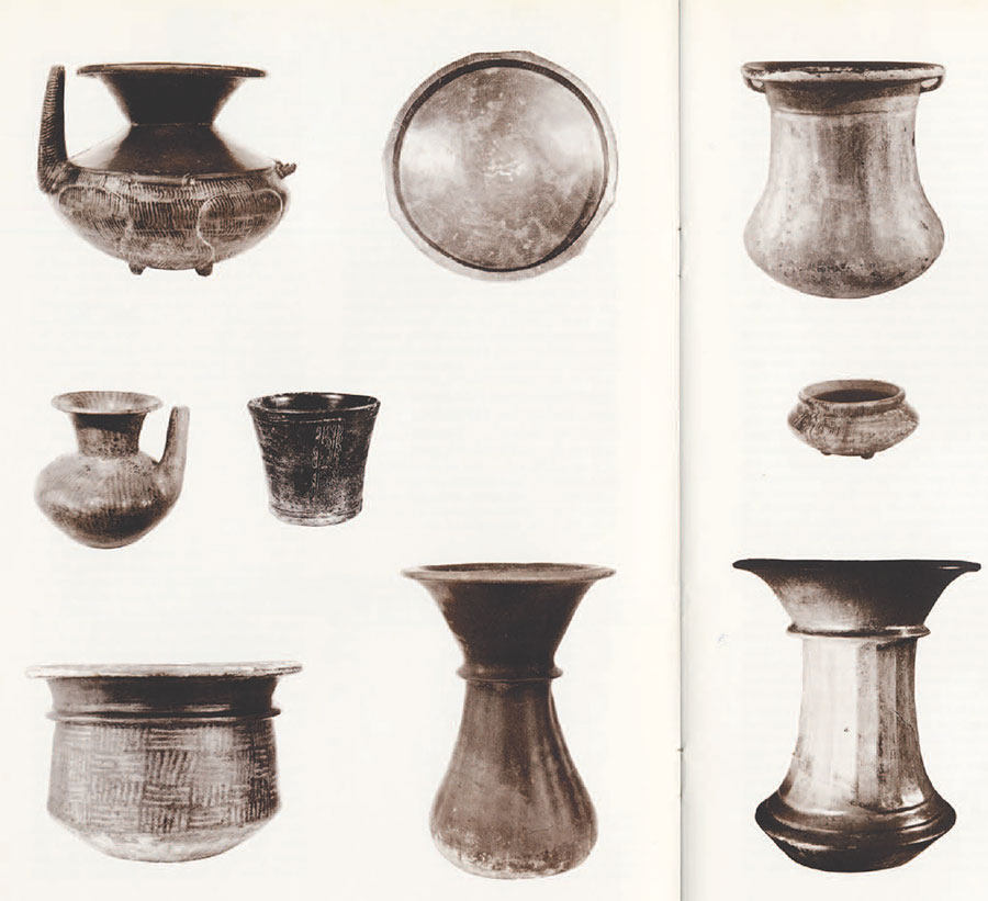 Nine vessels in a variety of shapes and sizes.