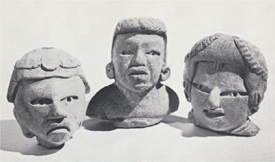 Three pottery jheads, each with different hair styles and face shapes.