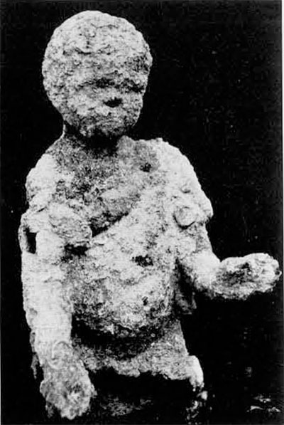Bronze statue, still covered with concretion, as it was pulled from the sea in 1963. This find offered the first clue to a possible shipwreck lying near Pascha harbor in 300 feet of water.