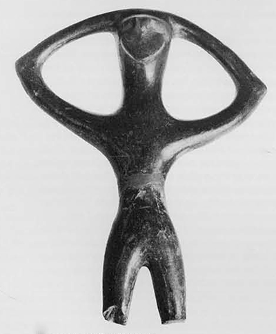 Handle in stylized human form from a pottery vessel. From Campovalano. 