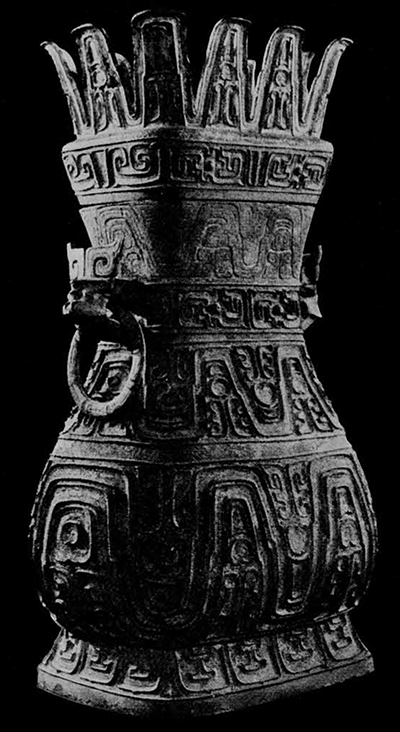 One of the ritual bronze vessels (Tsêng hu) discovered in a hoard in Ching-shan, province of Hupeh. It is well known type of wine vessel with a lid. It has a greenish blue patina. It was inscribed inside the lid and on the neck. The message is the same in both inscriptions, although the characters are arranged in different order. Transcription into modern Chinese by Kuo Mo-jo. "Tsêng the middle (middle of two brothers) visiting his father (used) auspicious metal and himself made this precious vessel." Western Chou period (ca. 9th century B.C.). Wên-wu 1972. No. 1. Pl. V.