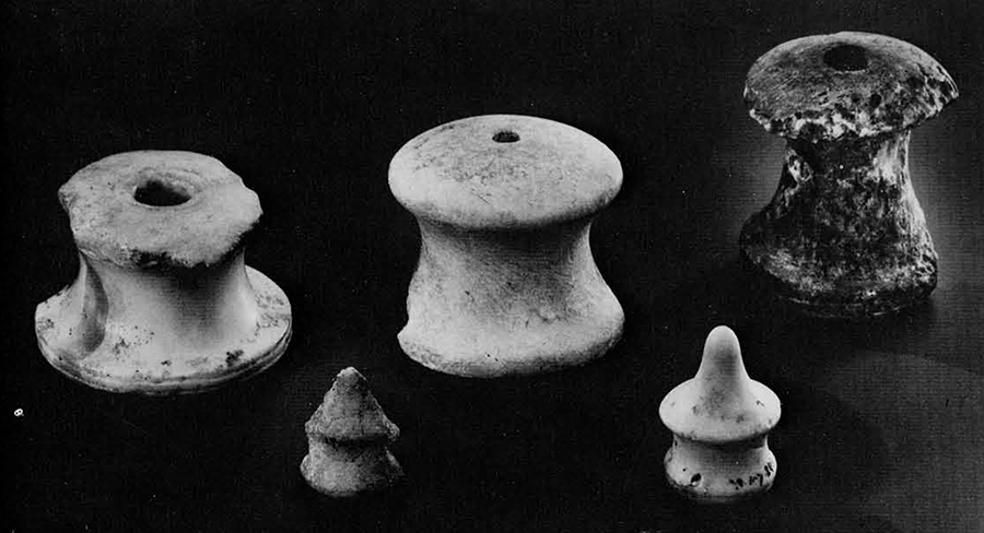 From a Beth Shan level of the 14th century B.C., these "knobs" parallel contemporary fittings on Tutankhamun's chariots. The saddle boss, rear row, right, is made from the local Beisan gypsum, as is the smaller of the yoke terminals in the front row. 