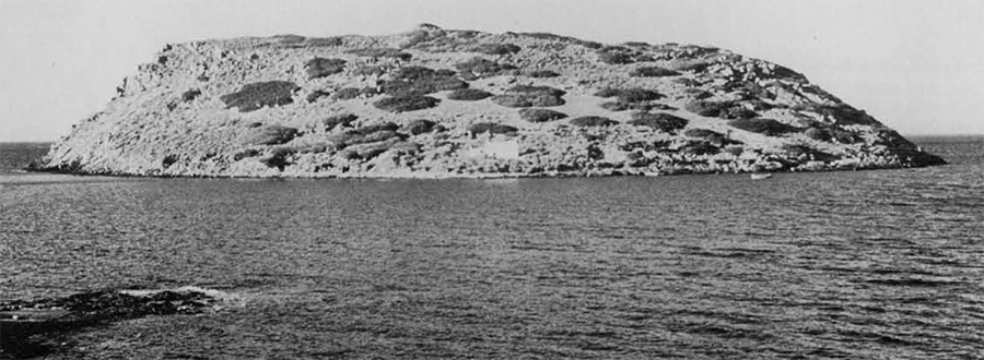 The Island of Mochlos from the south, showing the chapel of Agios Nikolaos.