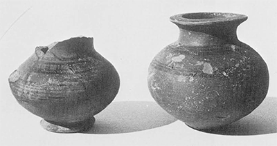 Southwest Anatolian Black-on-Red vessels: a "feeder" and a jar whose shape may have been inspired by the Lydian lydion; probably 6th century B.C. Gordion inventory P 739 and P998. Pot on right , 9 cm. 