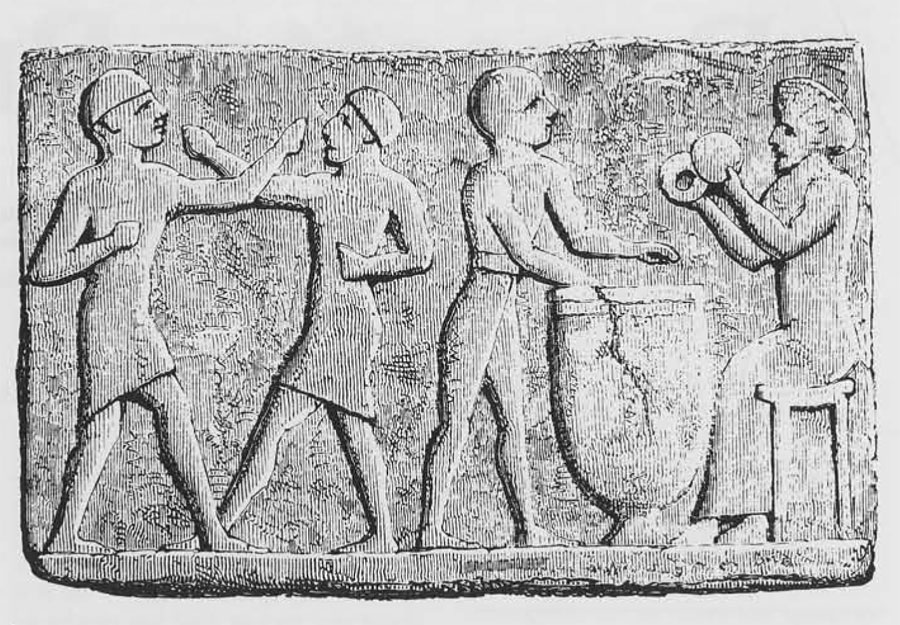 Two men box (?) while two others play drum and cymbals on this clay tablet from a tomb at Sinkara (Larsa in southern Iraq.)