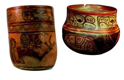 A red cup and bowl, each with three registers of symbols.