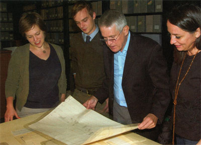 Ousterhout (center) examines drawings in the Museum Archives, with graduate students Stephanie Hagan, Jordan Pickett, and Daira Nocera.