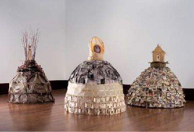 Three Graces (2005). 6' x 15' x 7', paper, reed, digital photos, red willow sticks, horsehair, wood, metal frame, identity tags, tracing paper, ribbon, and artificial flowers.