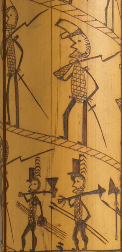 New Caledonia engraved bamboo: detail showing French soldier (top) and chief’s house with carved door posts and roof spire. UPM object #2003-32-6. Photo by Jim Millisky.