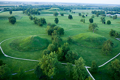 Photograph of the central precinct of Cahokia. The 100-foot- tall Monk’s Mound is visible at the top of the photograph. The twin mounds, which sit at the opposite end of the 45-acre plaza, are both at least 45 feet tall. Photograph courtesy of Ira Block Photography, Ltd.