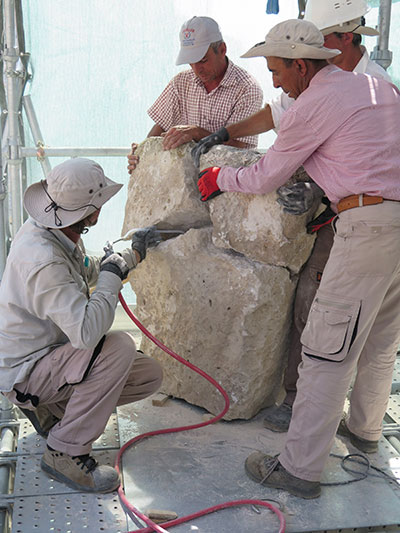 Members of the 2015 team work together to conserve masonry at the Citadel Gate. Photograph by Elisa Del Bono.