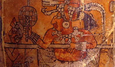 Mayan cylindrical painted pottery.