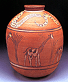 Ceramic jar with giraffe and snake