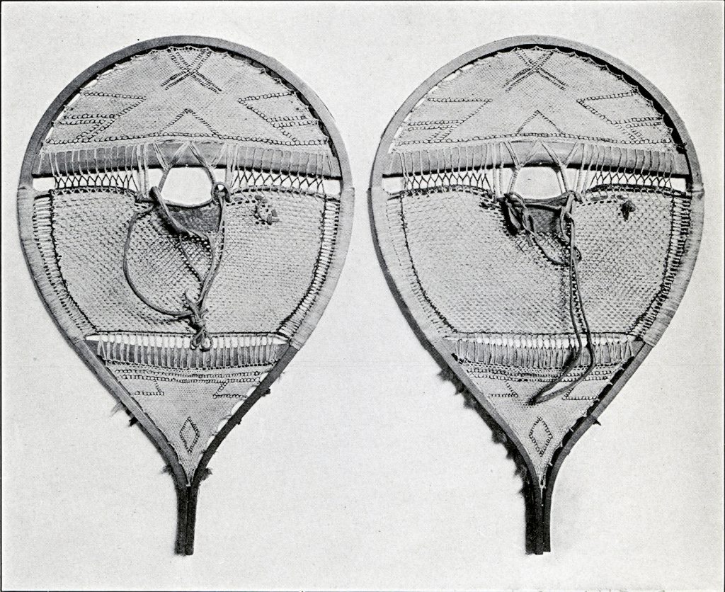 A pair of round snowshoes with patterns made with the stitching