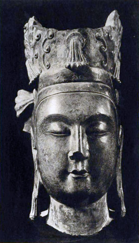 Life size stone head of a bodhisattva wearing a three peaked headdress