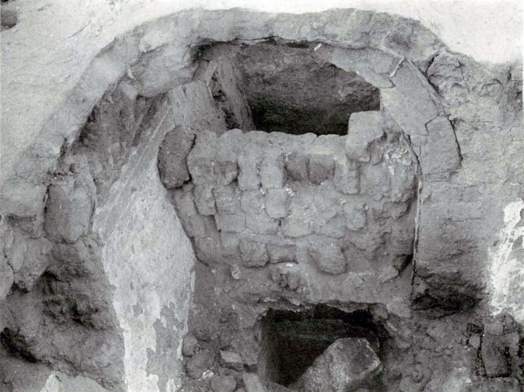 Interior of an excavated tomb with a ribbed vault showing interlocking construction