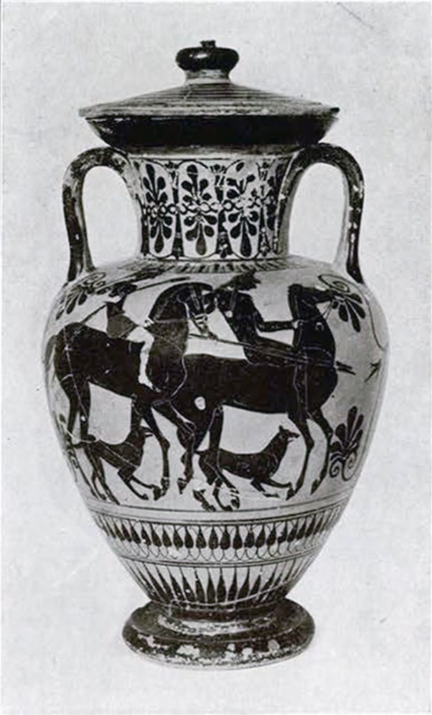 Black figure amphora with two handles and a lid showin two Amazons on horseback each accompanied by a dog