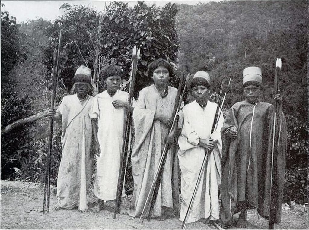 Five young Macoa men with holding bows and arrows, three wear hats