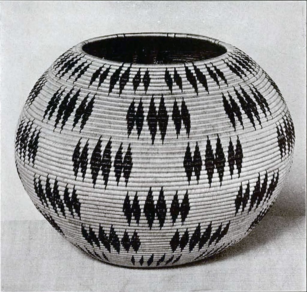 Round woven bowl-shaped basket with rhombus groupings as pattern