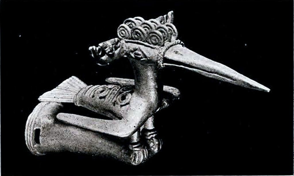 The head of a staff depicting a bird with a long beak