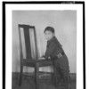San-lan-x. Male child leaning on chair seat with both hands, same subject but different pose than 14706.