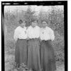 Gu tin, Gac-tu-kix-x, Xa-kan-dusox. Three young women standing together in woods. Haines, Alaska. Summer 1917.
