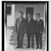 Tu-nat, Tawu-k-dutnuk, tqex-k. Three young men standing in front of steps. All dressed in modern suits. November 17, 1918. Haines, Alaska.