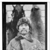 Nxc-k-num-caka-ayi. Chief in fur cap and elaborate hide jacket, with embroidered designs in hair and beadwork. December 25, 1928. Haines, Alaska.