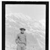 Ga-qux-k. Athabascan man with pick axe. Mt. background.  May 8, 1918.