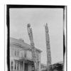 Wrangell - Two Poles - among wood pile in front of Victorian house - June/10/1924