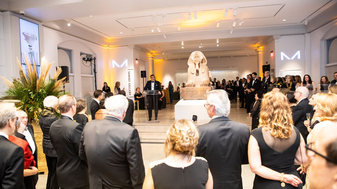 The director of the Museum giving a speech to gala attendees in the Sphinx Gallery.