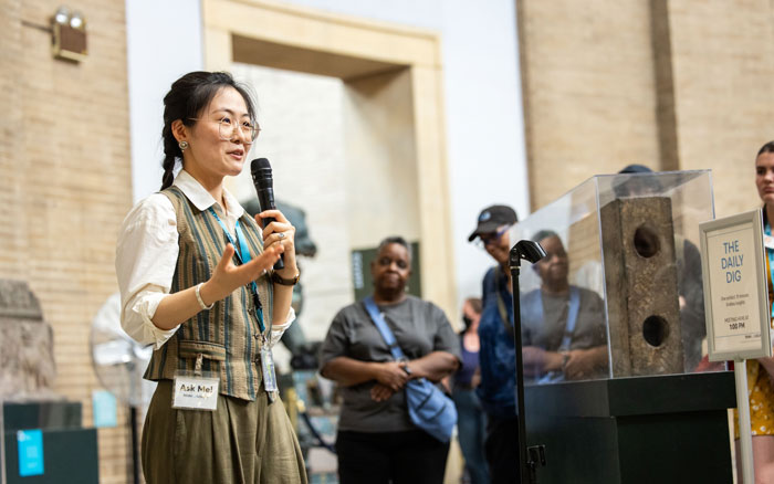 A tour guide giving a talk in the galleries.