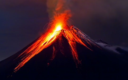 A volcano erupting.