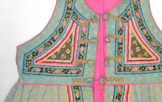 A sleeveless tunic with embroidered flowers.