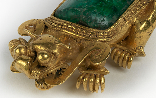 A gold jaguar pendant.
