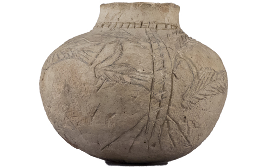 A ceramic jar with depictions of birds crudely scratched into the surface.