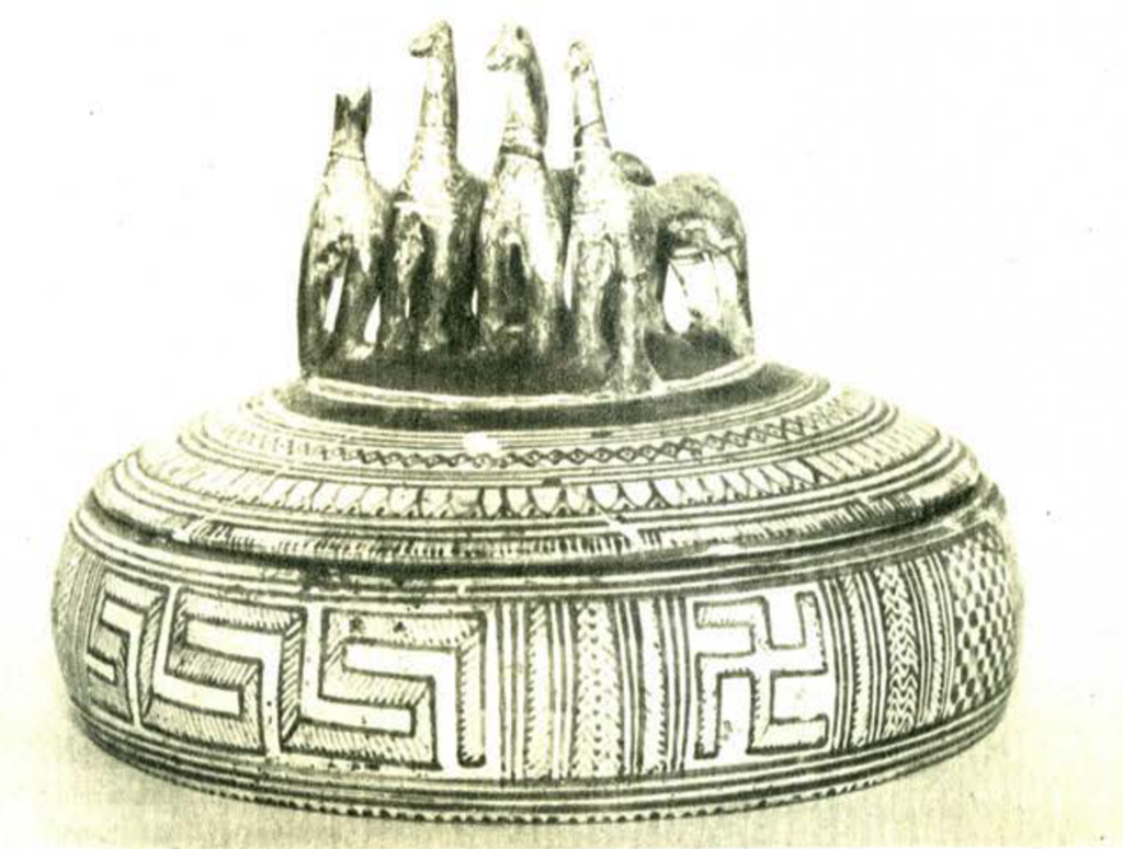 Geometric pyxis with four horses on lid