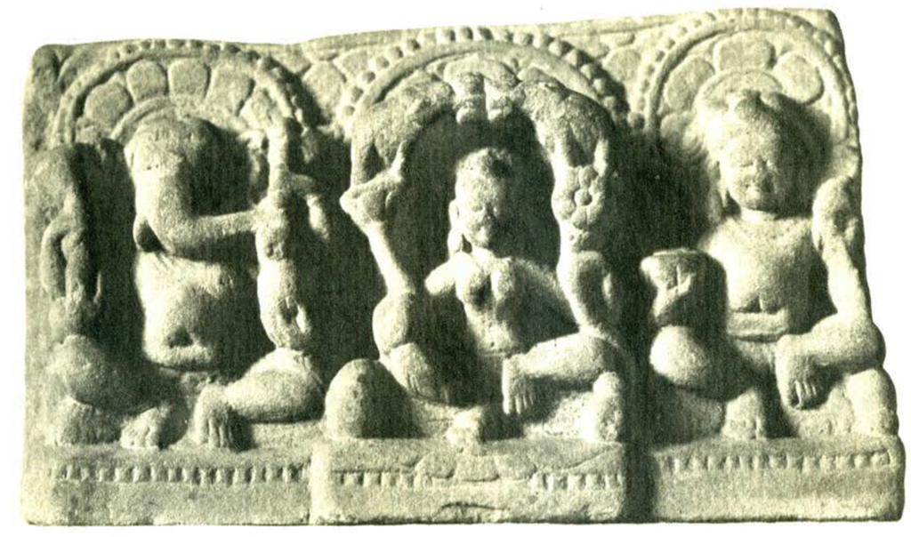 A sandstone relief showing three seated figures