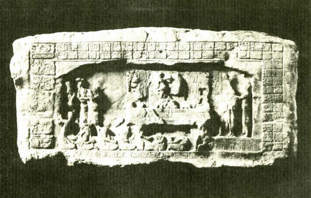 A part of a stone lintel showing a ceremony