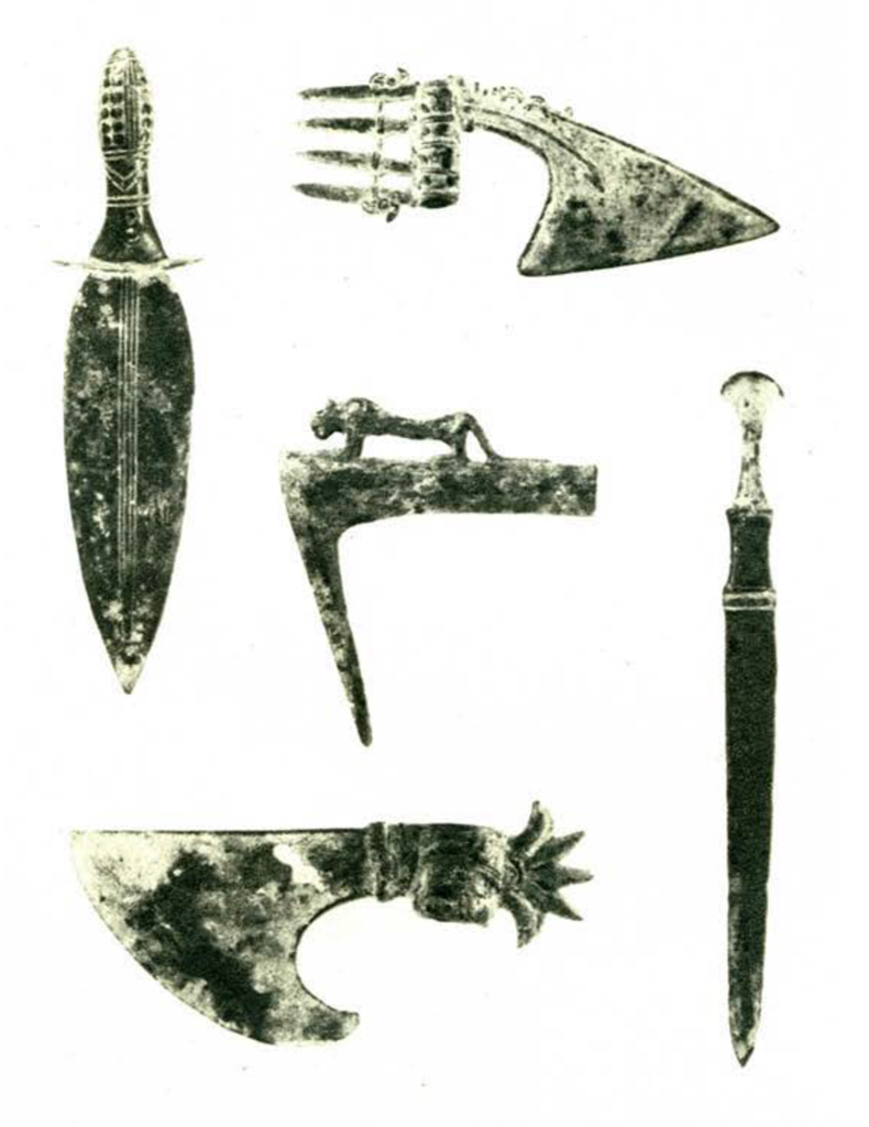 Five bronze objects, including a dagger and axe heads