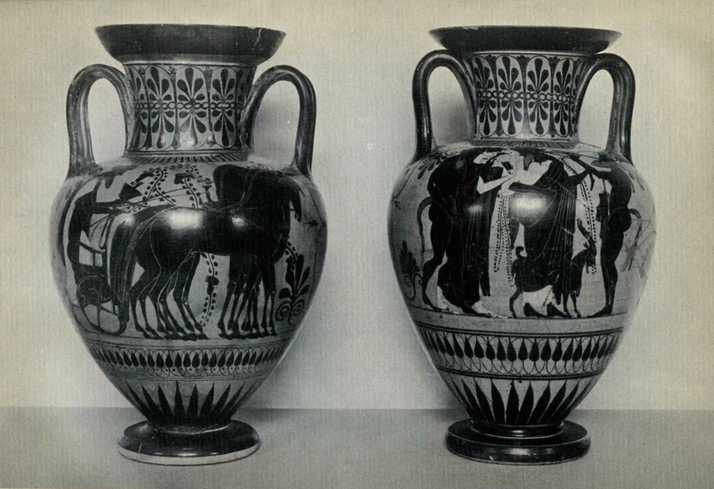 Two neck amphorae, one depicting a chariot scene, the other Dionysos with a maenad and a satyr