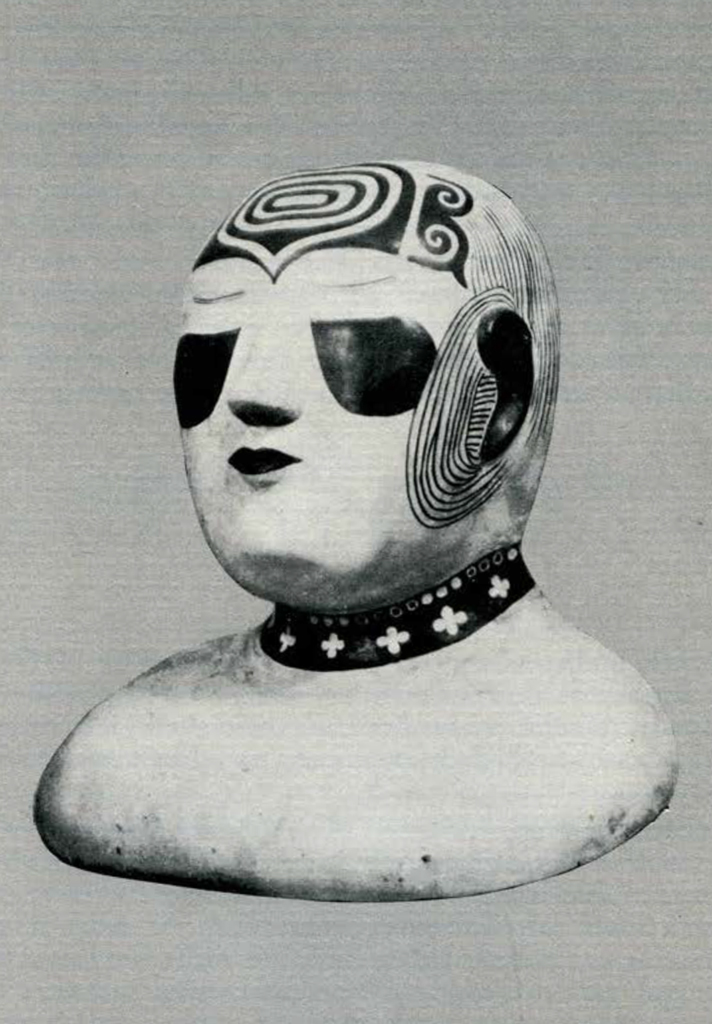 A painted plaster funerary mask with a painted on neckalce, and designs on the forehead and sides