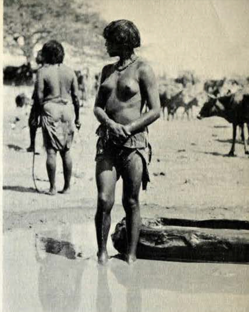 A woman standing in shallow water