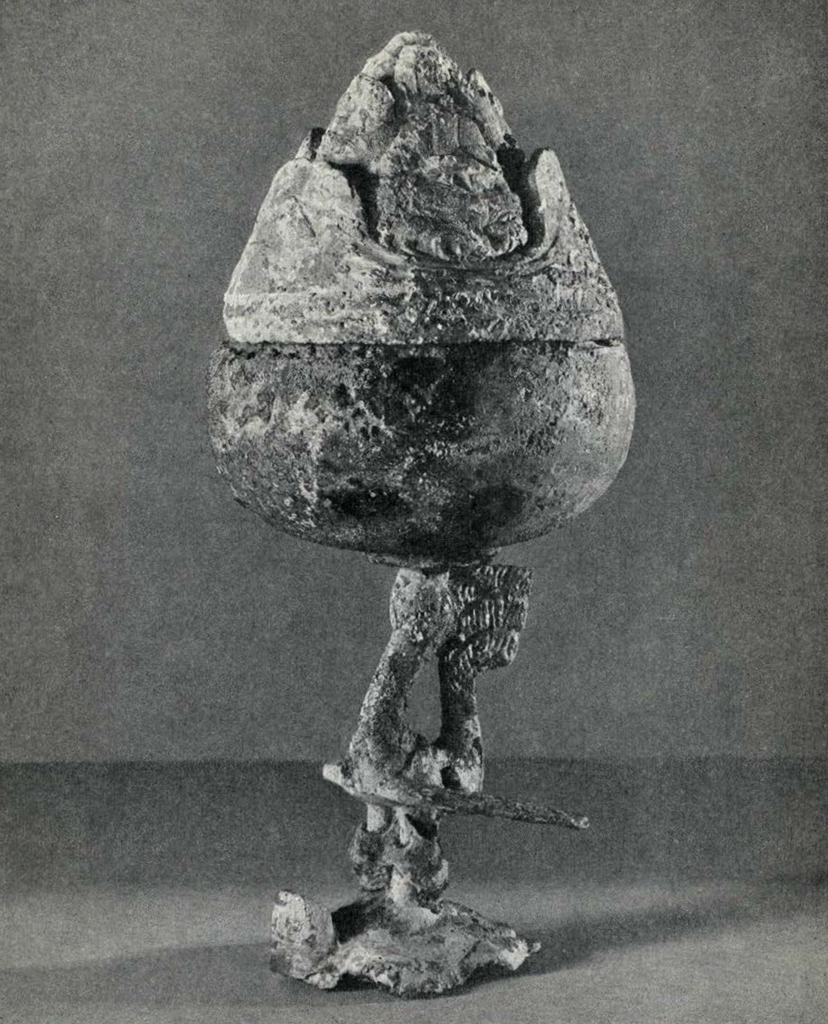 Incense burner on the form of a pheonix phoenix standing on the back of a tortoise supports the bowl, the cover of which is in the form of a 'hill' with figures of various animals depicted on the ledges