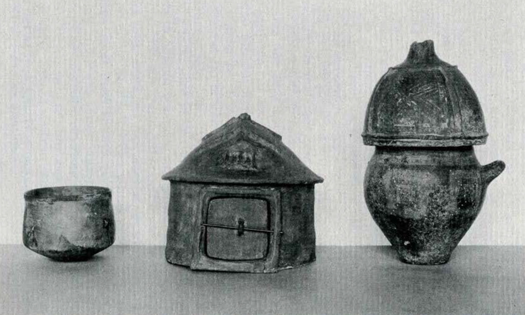 A small bowl and two urns, one in the shape of a hut