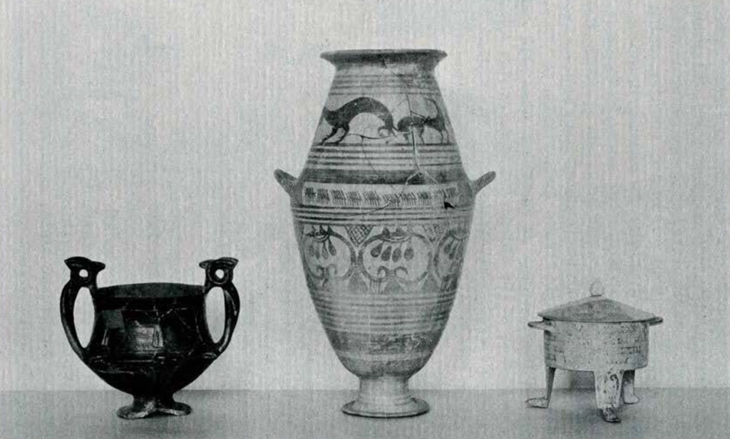 Three vessles, middle one decorated with animal and organic forms